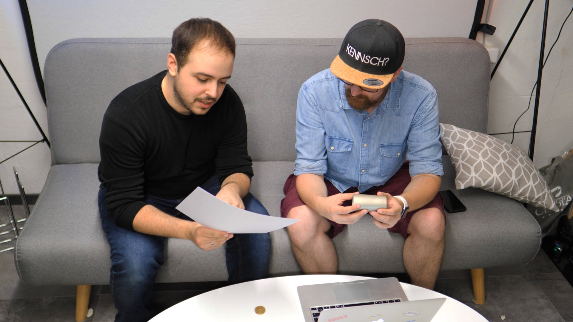 Two members of the WeissKlang team discussing a microphone